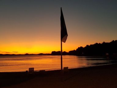 Plaz Lolic zapad slnka modra vlajka